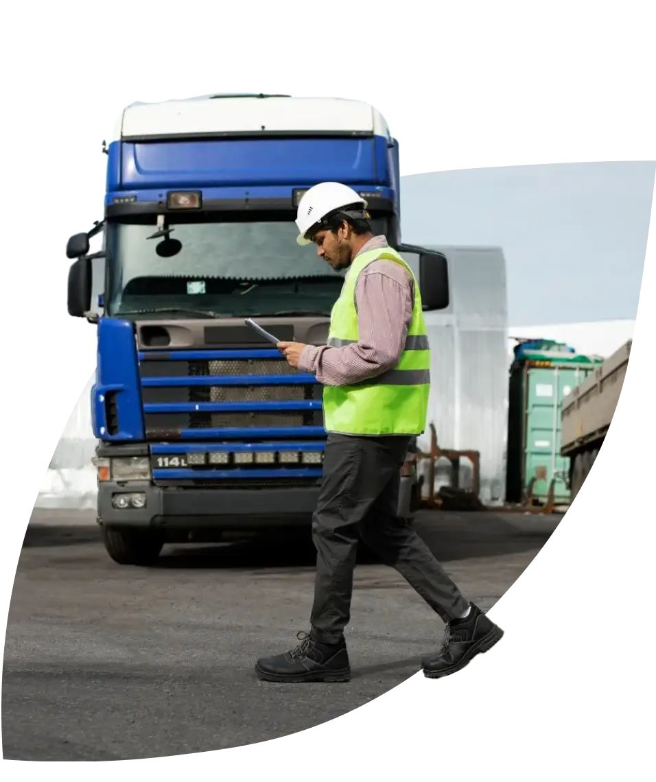 worker in front of a truck