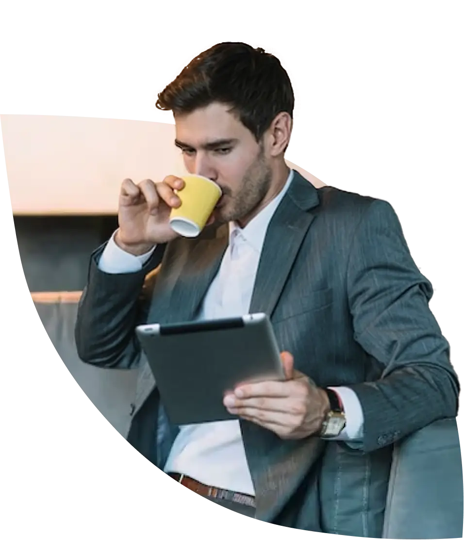 a business man drinking coffee being focused