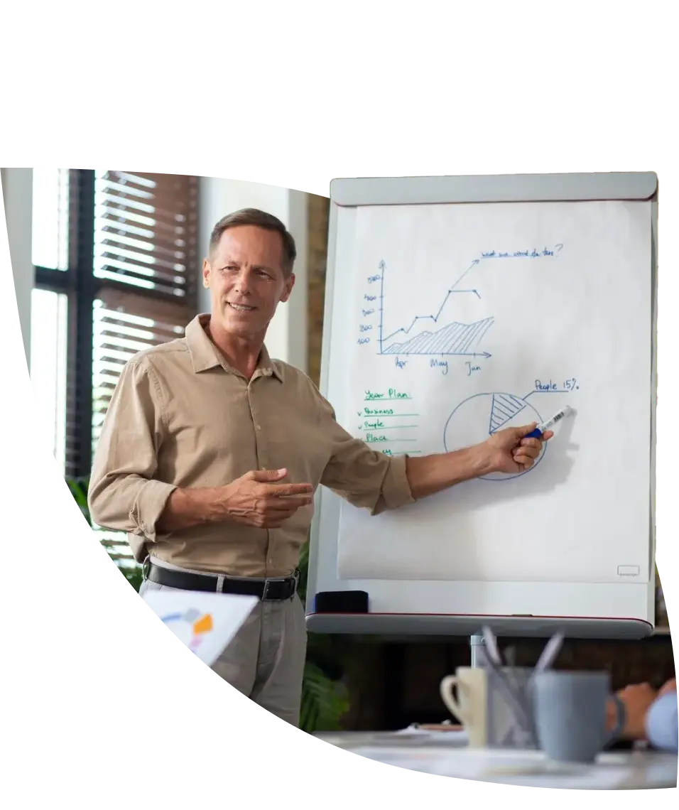 man explaining something on a whiteboard